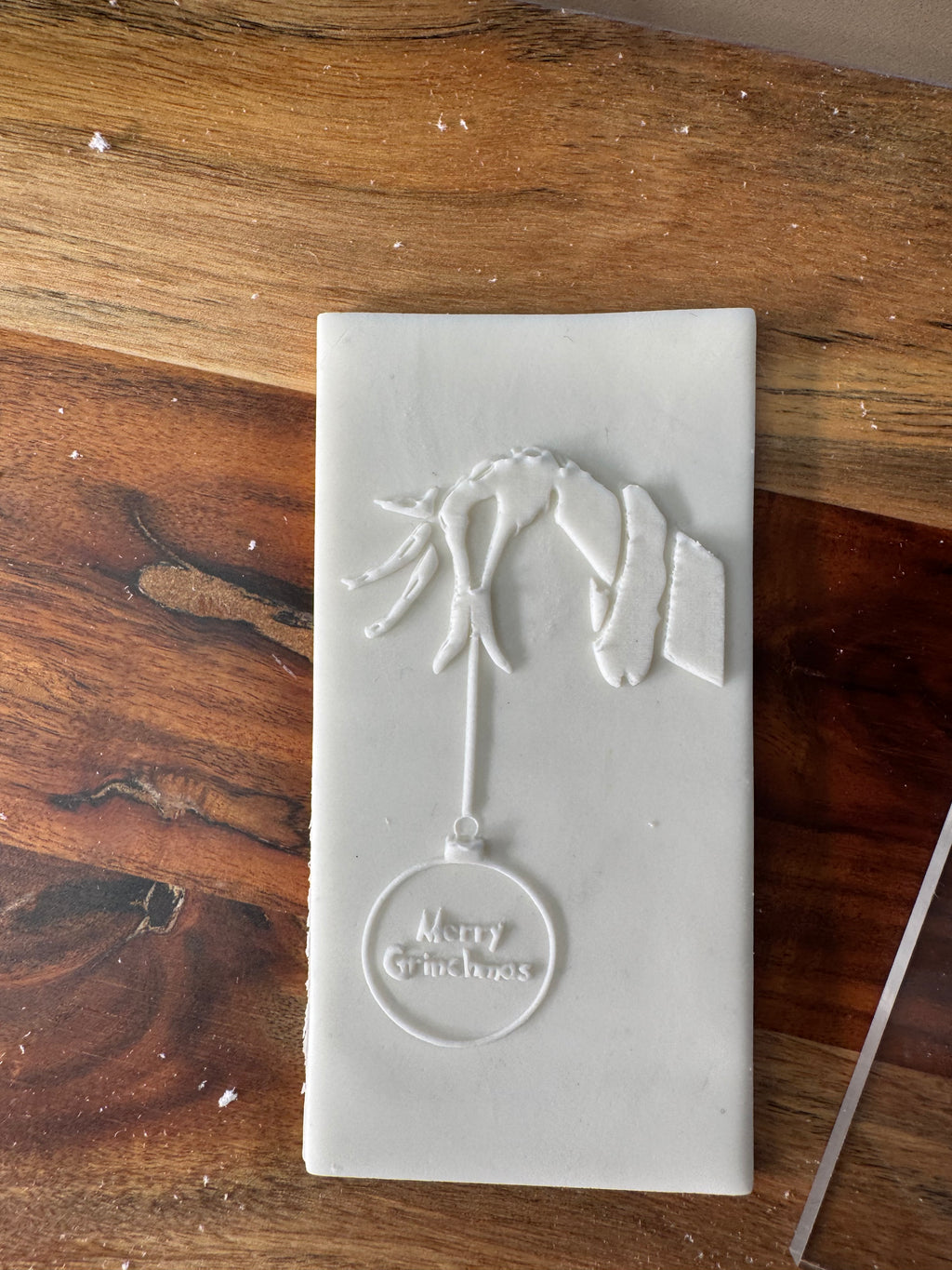 Grinch Hand with Merry Christmas Bauble