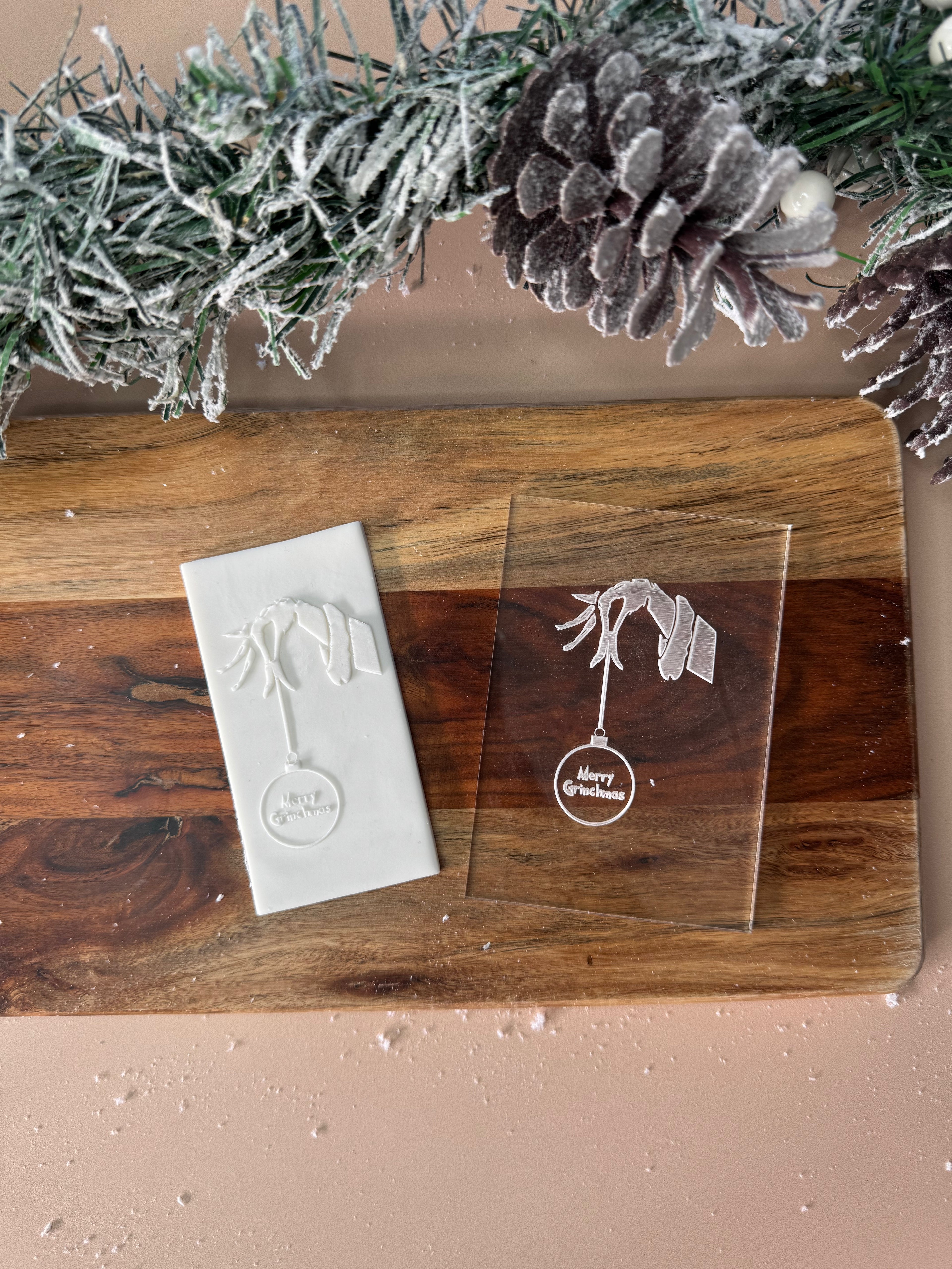 Grinch Hand with Merry Christmas Bauble